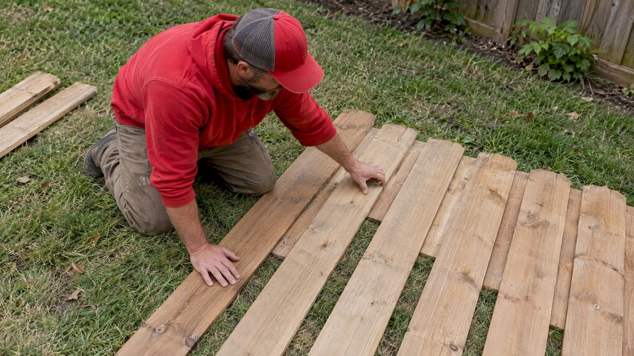 Fence pickets laid out to check even overlap